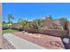 Well-maintained backyard featuring desert landscaping, including a cozy fire pit area at 4560 E Paso Trl, Phoenix, AZ 85050