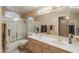 Bright bathroom with double sinks, shower, bathtub, and natural light at 4560 E Paso Trl, Phoenix, AZ 85050