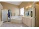 Ensuite bath featuring a separate shower, large soaking tub and large vanity with a mirror at 4560 E Paso Trl, Phoenix, AZ 85050