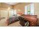 Bedroom featuring neutral colors, carpet, plantation shutters and a built-in desk at 4560 E Paso Trl, Phoenix, AZ 85050