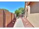 Side yard pathway with meticulous landscaping and charming architectural details at 4560 E Paso Trl, Phoenix, AZ 85050