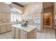 Bright kitchen with an island, double ovens, and large window at 4560 E Paso Trl, Phoenix, AZ 85050
