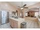 Open kitchen featuring an island, stainless steel appliances, and modern lighting at 4560 E Paso Trl, Phoenix, AZ 85050