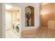 Inviting laundry room featuring modern washer and dryer, tiled floors and a decorative niche at 4560 E Paso Trl, Phoenix, AZ 85050