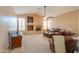 Cozy living room with a fireplace, leather furniture, and a large window at 4560 E Paso Trl, Phoenix, AZ 85050