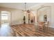 Open floor plan with wood floors, neutral walls, and views of other rooms at 4560 E Paso Trl, Phoenix, AZ 85050