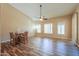 Spacious living area features hardwood floors, multiple windows, and a ceiling fan at 4560 E Paso Trl, Phoenix, AZ 85050