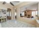 Open-concept living room with arched doorways and a view of the kitchen and Gathering room at 4560 E Paso Trl, Phoenix, AZ 85050