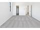 This carpeted bedroom features a walk-in closet and neutral colors at 5501 W Whispering Wind Dr, Glendale, AZ 85310