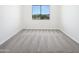 Carpeted bedroom features a large window with neighborhood views at 5501 W Whispering Wind Dr, Glendale, AZ 85310
