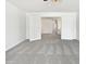 Bright bedroom with plush carpet and double doors to another room at 5501 W Whispering Wind Dr, Glendale, AZ 85310