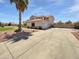 Beautiful two-story home with an extended driveway and manicured lawn at 5501 W Whispering Wind Dr, Glendale, AZ 85310