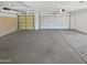 Spacious garage with ample room for multiple vehicles and storage at 5501 W Whispering Wind Dr, Glendale, AZ 85310