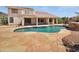 Inviting outdoor pool and patio area perfect for relaxation and entertaining guests at 5501 W Whispering Wind Dr, Glendale, AZ 85310