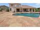 Inviting outdoor pool and patio area perfect for relaxation and entertaining guests at 5501 W Whispering Wind Dr, Glendale, AZ 85310