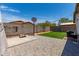 Backyard featuring a paved patio, artificial turf, and a basketball hoop at 5526 W Ellis Dr, Laveen, AZ 85339