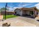 Spacious backyard with patio, artificial turf, and covered patio area at 5526 W Ellis Dr, Laveen, AZ 85339