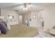 Spacious bedroom with vanity, ensuite bathroom, ceiling fan and large bed at 5526 W Ellis Dr, Laveen, AZ 85339