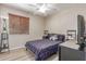 Comfortable bedroom featuring laminate flooring, a ceiling fan, and an inviting atmosphere at 5526 W Ellis Dr, Laveen, AZ 85339