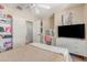 Well-lit bedroom with a ceiling fan, built-in shelving, and neutral color palette at 5526 W Ellis Dr, Laveen, AZ 85339