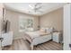 Cozy bedroom with natural light, neutral tones, a ceiling fan, and laminate flooring at 5526 W Ellis Dr, Laveen, AZ 85339