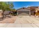 Charming single-story home with a two-car garage and low-maintenance desert landscaping at 5526 W Ellis Dr, Laveen, AZ 85339