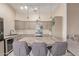 Stylish kitchen featuring modern cabinets, stainless steel appliances, and an island with seating at 5526 W Ellis Dr, Laveen, AZ 85339