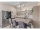 Beautiful kitchen with stainless steel appliances and an island with bar seating at 5526 W Ellis Dr, Laveen, AZ 85339
