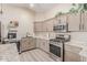 Bright kitchen featuring stainless steel appliances, light wood cabinets, and light countertops at 5526 W Ellis Dr, Laveen, AZ 85339