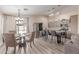 Inviting open-concept kitchen and dining area with stainless steel appliances and modern finishes at 5526 W Ellis Dr, Laveen, AZ 85339