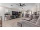 Bright living room with wood-look floors and comfortable seating at 5526 W Ellis Dr, Laveen, AZ 85339