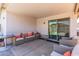 Covered patio with ample seating and sliding glass door access at 5526 W Ellis Dr, Laveen, AZ 85339