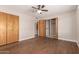 Bright bedroom with ample closet space and a ceiling fan for added comfort at 5627 E Covina Rd, Mesa, AZ 85205