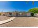 Charming single-story home with a well-maintained yard and inviting walkway at 5627 E Covina Rd, Mesa, AZ 85205
