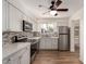 Well-equipped kitchen featuring stainless steel appliances and updated cabinets with appealing countertops at 5627 E Covina Rd, Mesa, AZ 85205