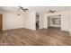 Open living area with updated flooring, ceiling fans, and natural light at 5627 E Covina Rd, Mesa, AZ 85205