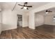 Living room with updated flooring leading into the laundry area at 5627 E Covina Rd, Mesa, AZ 85205