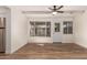 Bright, airy sunroom with updated flooring and multiple windows at 5627 E Covina Rd, Mesa, AZ 85205