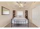 Comfortable bedroom features a queen bed, ceiling fan, and built-in bookshelves at 6073 E Beck Ln, Scottsdale, AZ 85254