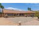 Charming single-story home featuring desert landscaping, a clay roof, and a desert style color scheme at 6073 E Beck Ln, Scottsdale, AZ 85254