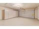 Spacious garage with ample storage cabinets and epoxy flooring, perfect for organization and functionality at 6073 E Beck Ln, Scottsdale, AZ 85254
