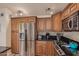 Gourmet kitchen features stainless steel refrigerator and built-in microwave at 6073 E Beck Ln, Scottsdale, AZ 85254