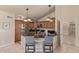 Open kitchen with granite countertops, stainless appliances, and eat in bar at 6073 E Beck Ln, Scottsdale, AZ 85254