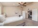 Comfortable main bedroom featuring a ceiling fan, closet, and ensuite bathroom at 6073 E Beck Ln, Scottsdale, AZ 85254