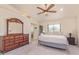 Main bedroom features a ceiling fan, closet, and ensuite bathroom at 6073 E Beck Ln, Scottsdale, AZ 85254