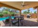 Outdoor patio with a table, chairs, and a built-in barbeque near the pool at 6073 E Beck Ln, Scottsdale, AZ 85254