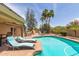 Resort-style pool and patio with lounge chairs and desert landscaping at 6073 E Beck Ln, Scottsdale, AZ 85254