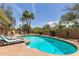Resort-style pool and patio with lounge chairs and desert landscaping at 6073 E Beck Ln, Scottsdale, AZ 85254