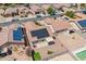 Aerial view showcases solar panels, patio, and easy access to a community pool at 645 W Kingman Loop, Casa Grande, AZ 85122