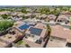 Aerial view of a neighborhood home featuring solar panels and a patio area at 645 W Kingman Loop, Casa Grande, AZ 85122